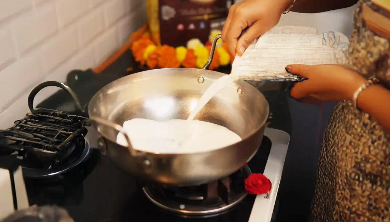 Heat the milk in a heavy-bottomed pot over medium